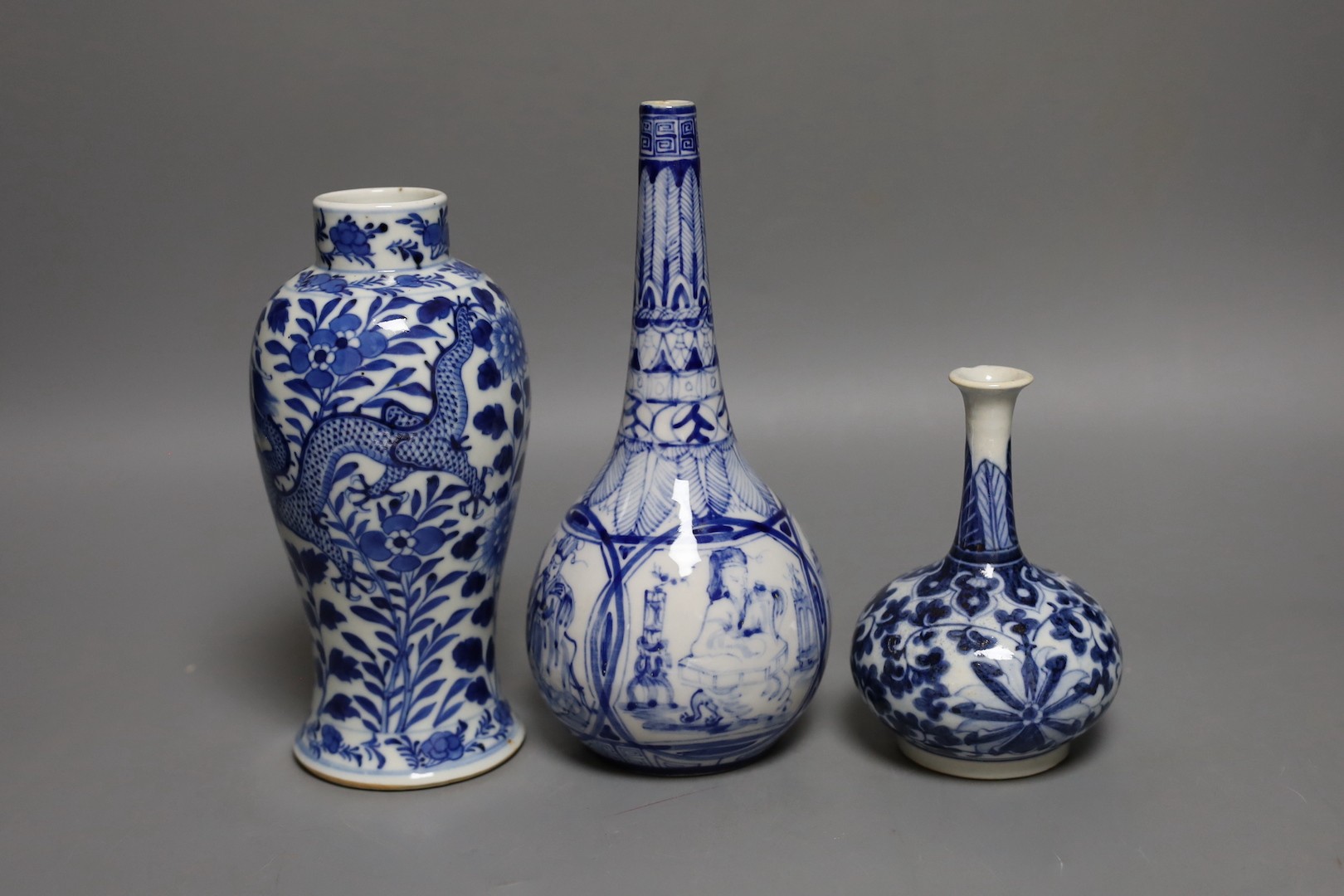 A Chinese blue and white ‘Dragon’ baluster vase and two blue and white bottle vases, 19th century and later, Tallest 21 cms.